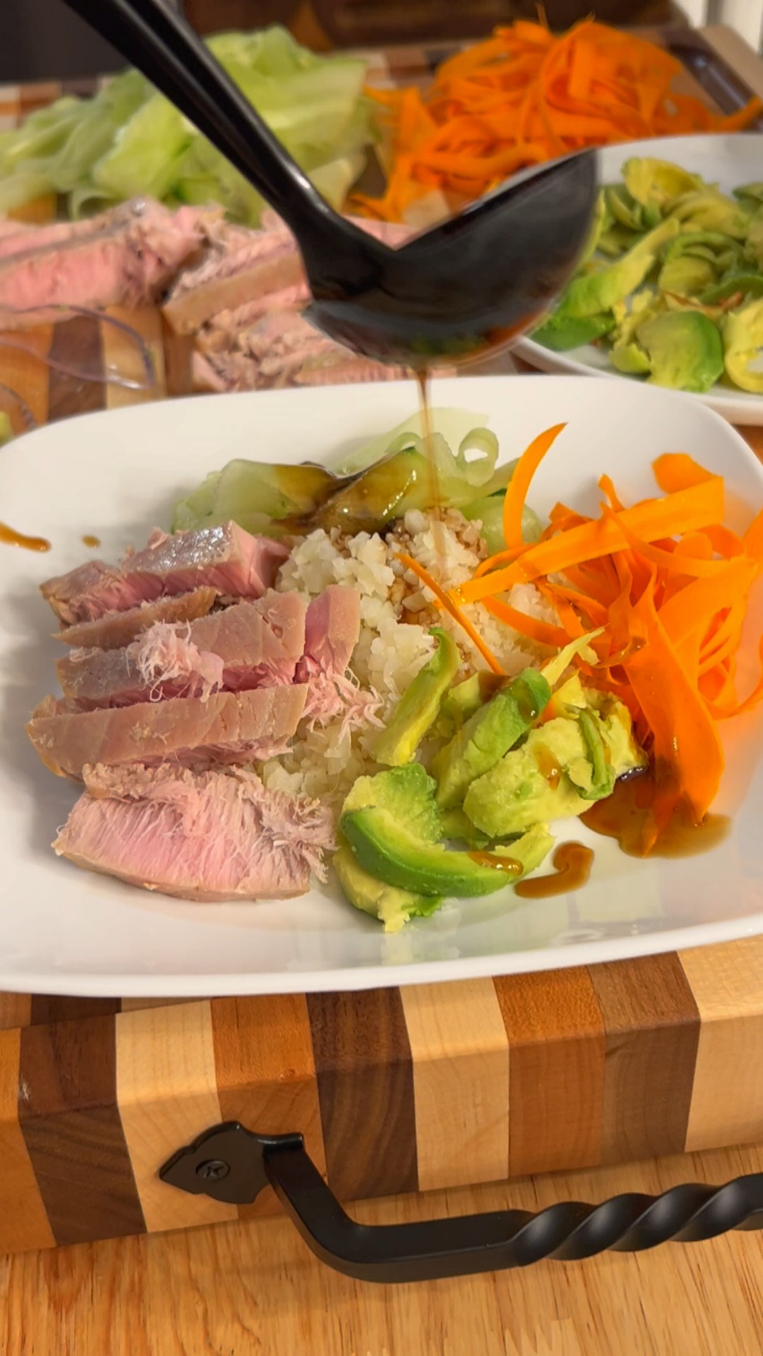 Air fried tuna bowl with cauliflower rice, cucumber, carrot ribbons, and avocado