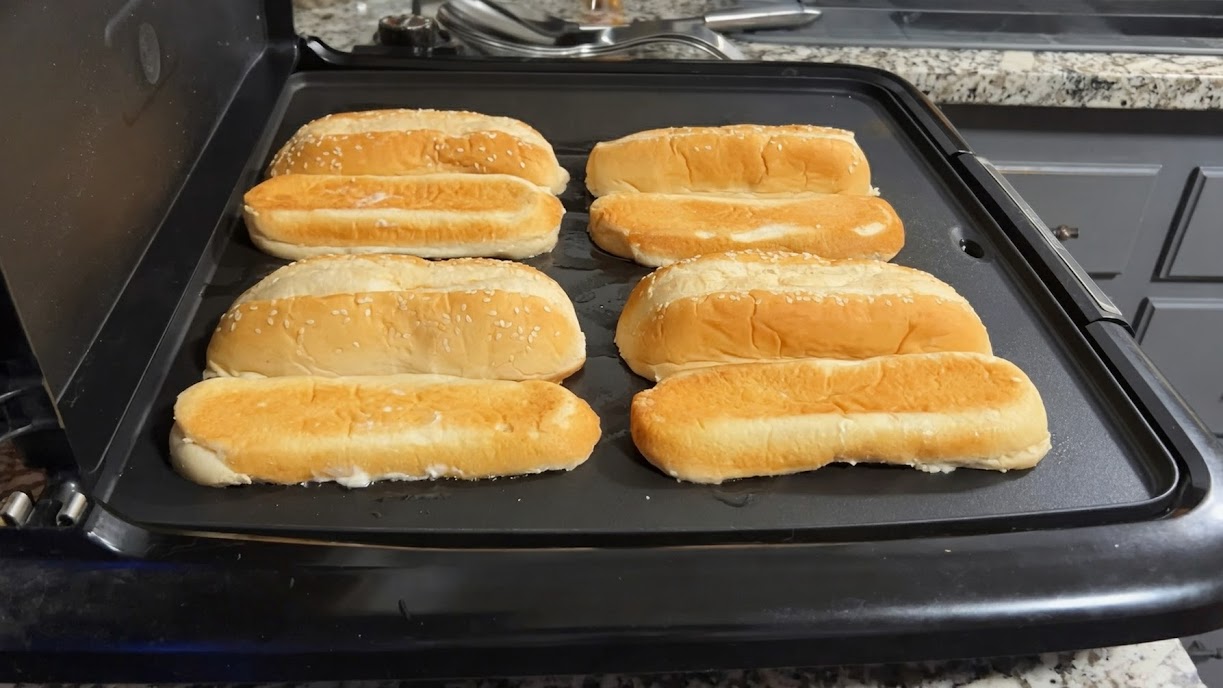 Hoagie rolls toasted on the griddle