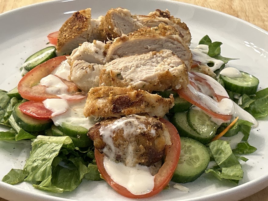 Air fried ranch chicken breasts on salad